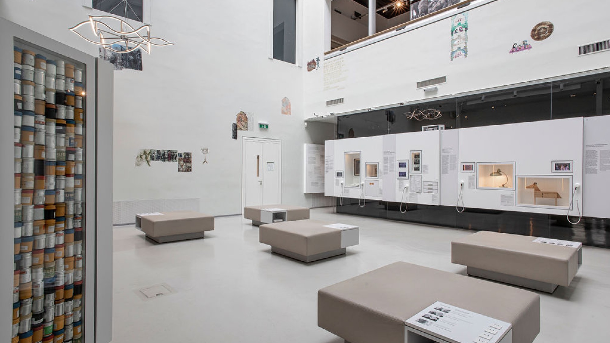 Exhibition room at Jewish Museum Vienna: Modern exhibition space at the Jewish Museum Vienna with seating, display cases, and contemporary artworks on white walls.