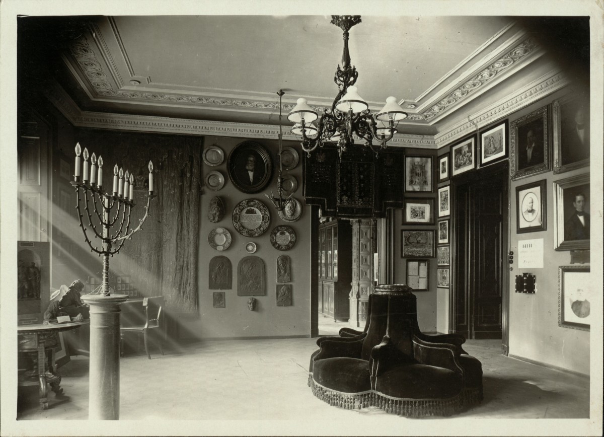 : Black and white photographs of the rooms at the first Jewish Museum Vienna at the Malzgasse 16 location