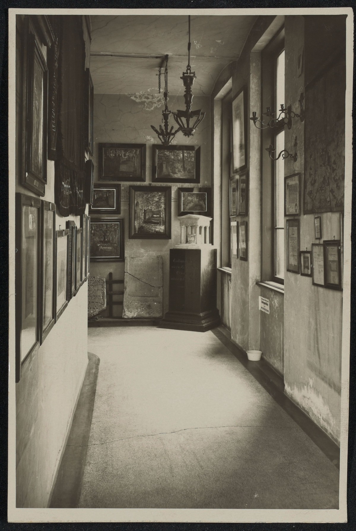 : Black and white photographs of the rooms at the first Jewish Museum Vienna at the Malzgasse 16 location