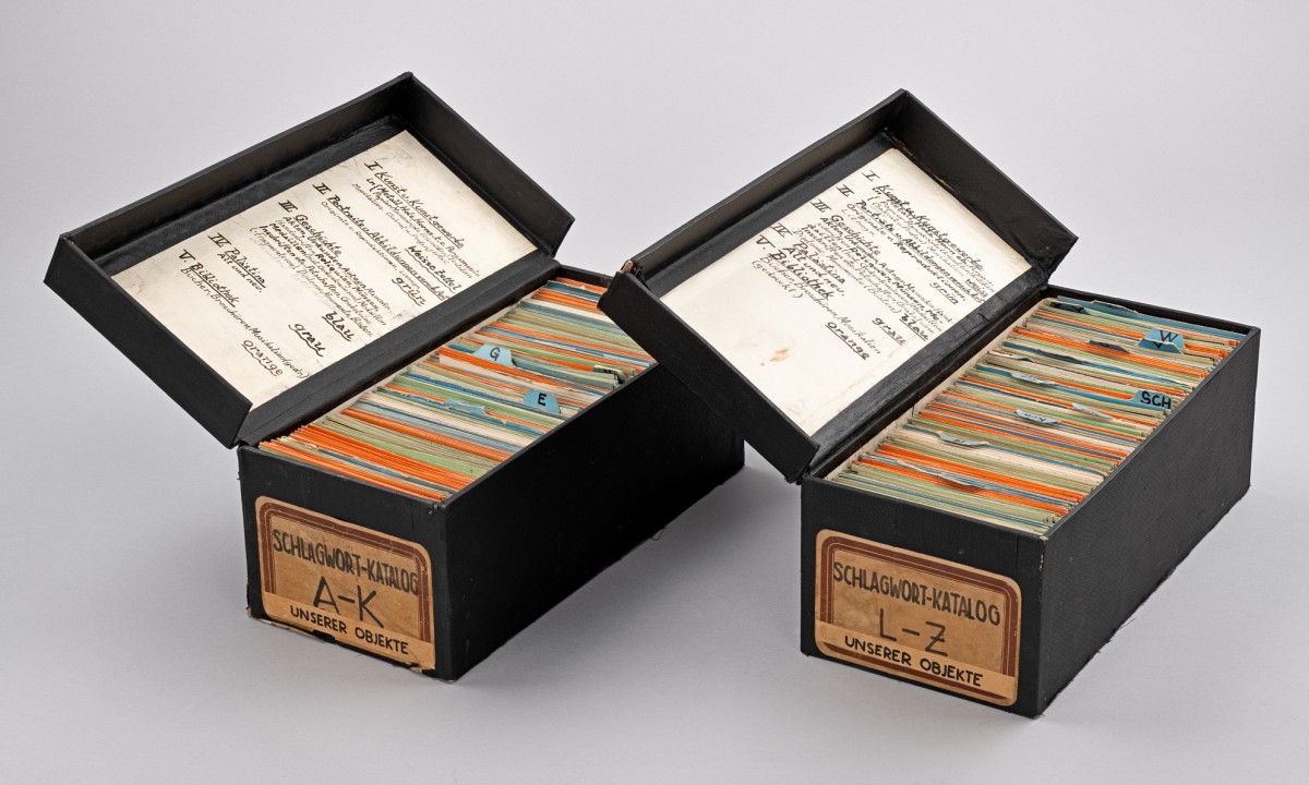 Two black boxes filled with colorful index cards