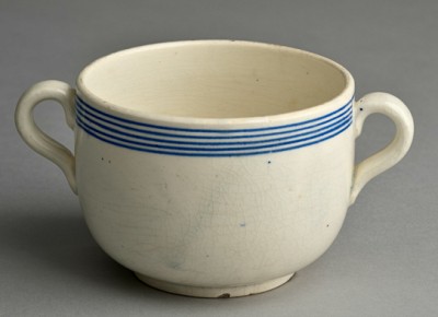 : A painted porcelain soup cup that was on display at a Jewish museum.